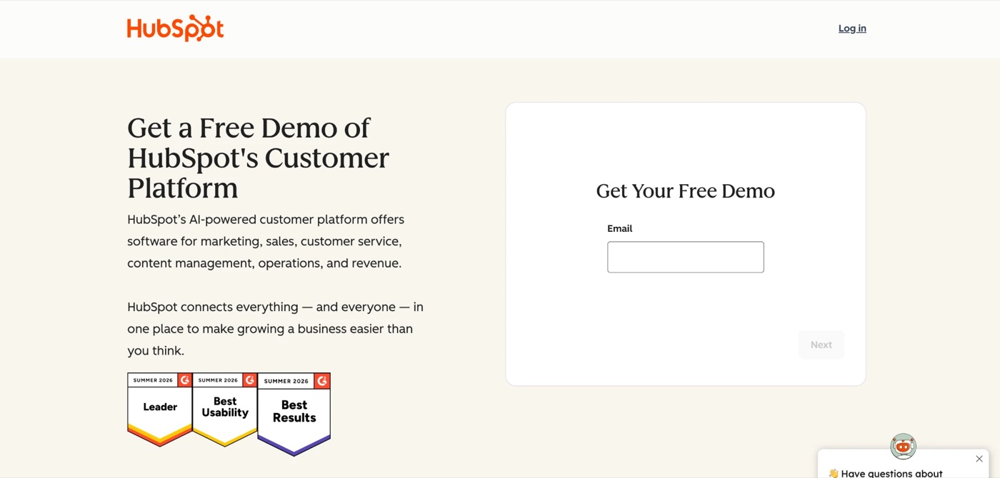 The HubSpot homepage in 2026 presents its AI-powered customer platform spanning marketing, sales, customer service, content management, operations, and revenue, with a free-demo signup form and G2 Summer 2026 Leader, Best Usability, and Best Results badges.