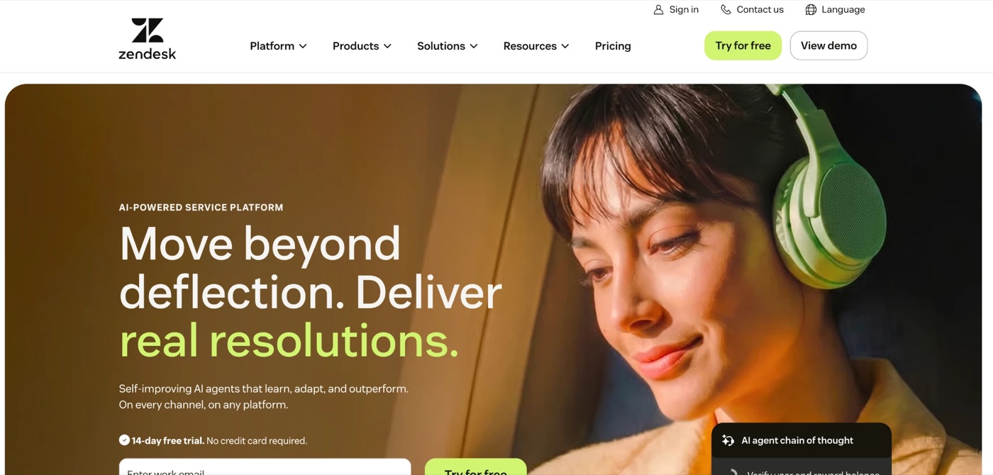 The Zendesk homepage in 2026 positions the product as an AI-powered service platform, with the headline "Move beyond deflection. Deliver real resolutions." and a 14-day free trial call to action.