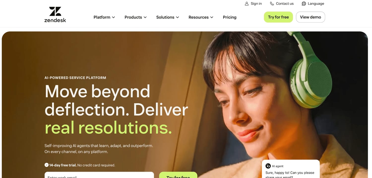 The Zendesk homepage in 2026 positions the product as an AI-powered service platform, with the headline "Move beyond deflection. Deliver real resolutions." and a 14-day free trial call to action.